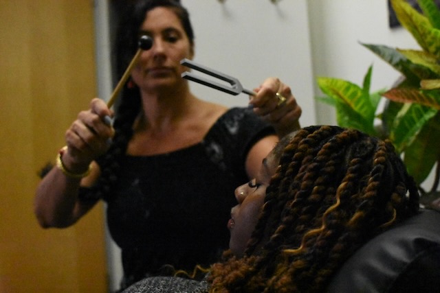 Dana Bagdasarian using tuning fork with client at Pepper Tree Wellness