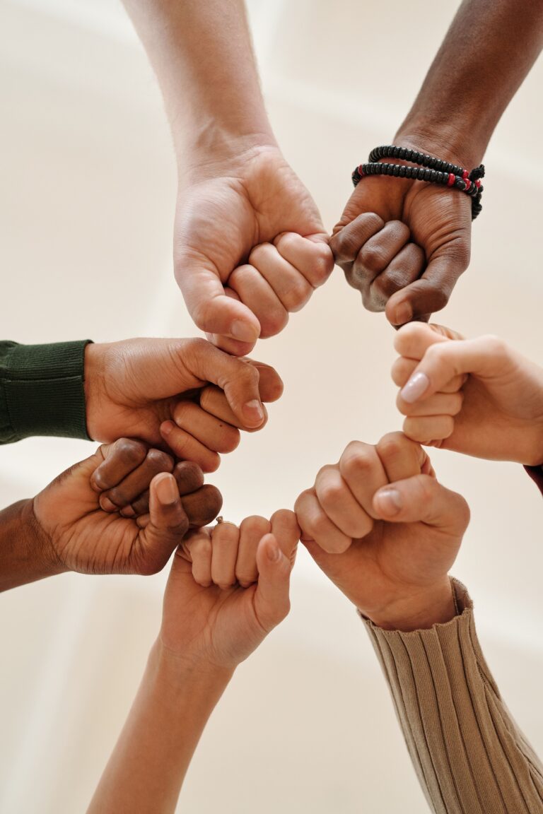 Group of people enjoying a heart-centered wellness gathering and connection circle